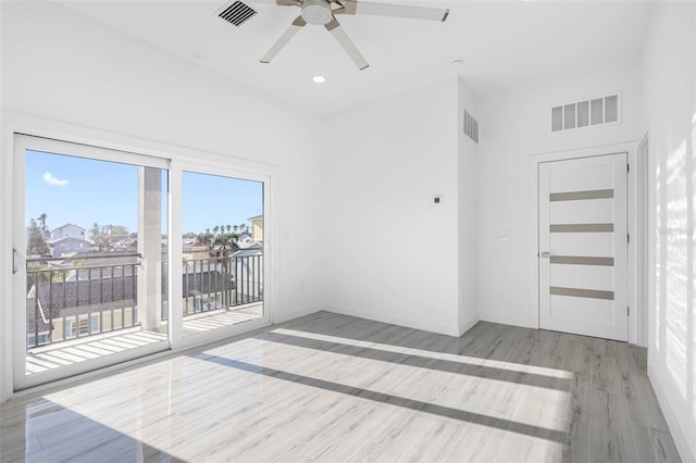 unfurnished room featuring light wood-type flooring and ceiling fan