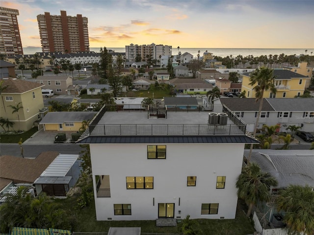 aerial view at dusk with a water view