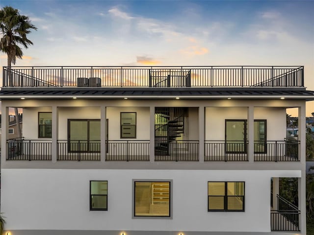 view of outdoor building at dusk