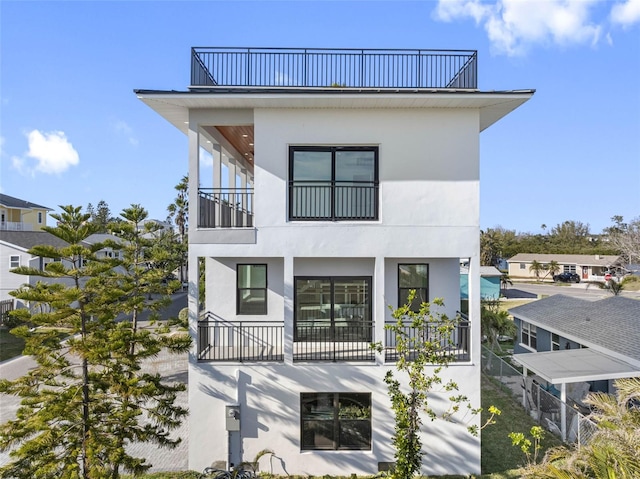 rear view of house with a balcony