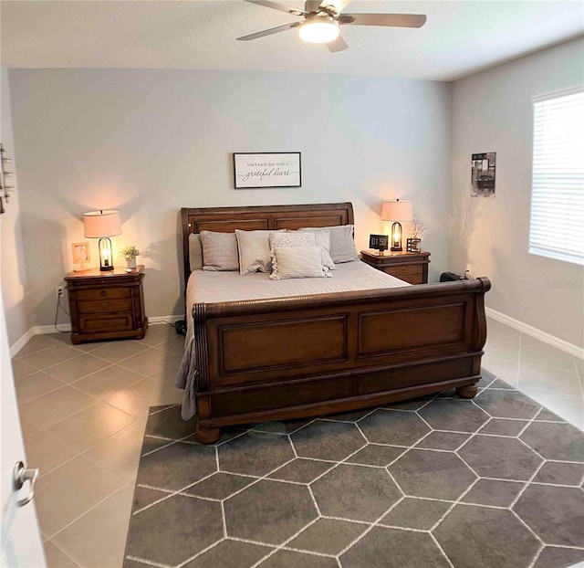 tiled bedroom with ceiling fan