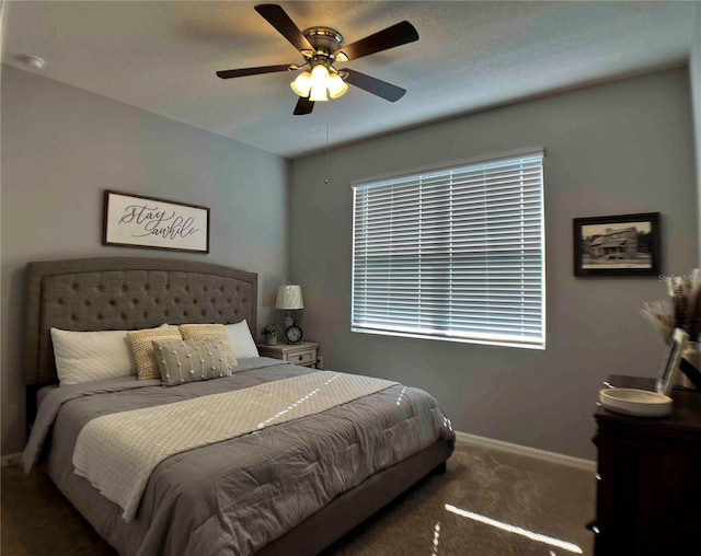 carpeted bedroom featuring ceiling fan