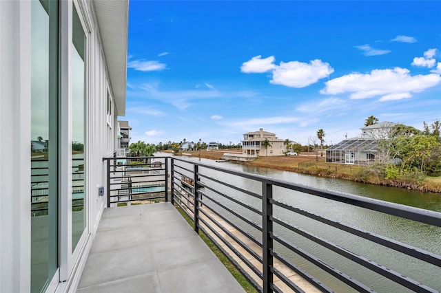 balcony featuring a water view