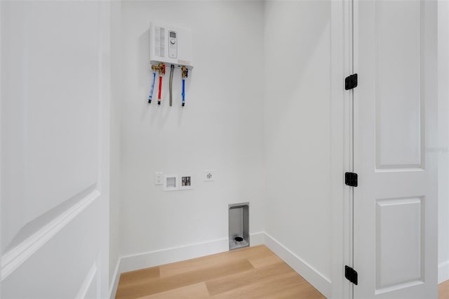 laundry area with hardwood / wood-style flooring, washer hookup, and hookup for an electric dryer