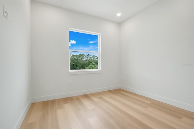 spare room featuring light wood-type flooring