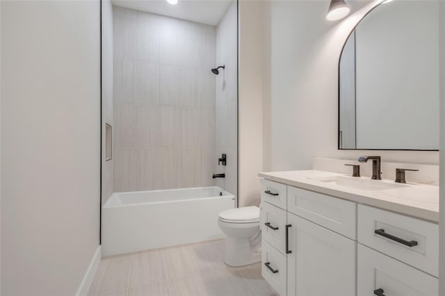 full bathroom featuring tile patterned floors, vanity, toilet, and tiled shower / bath combo