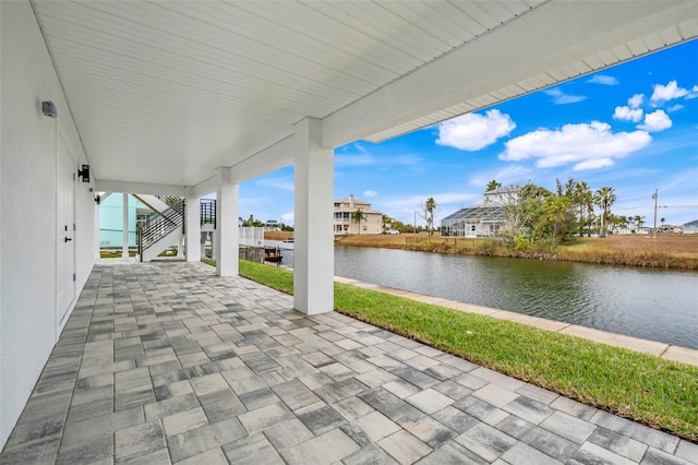 3431 Palometa Dr, Hernando Beach, FL 34607 - view of patio with stairs and a water view