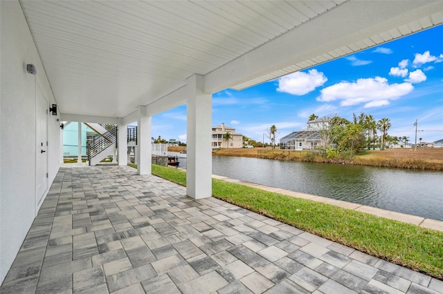 view of patio featuring a water view