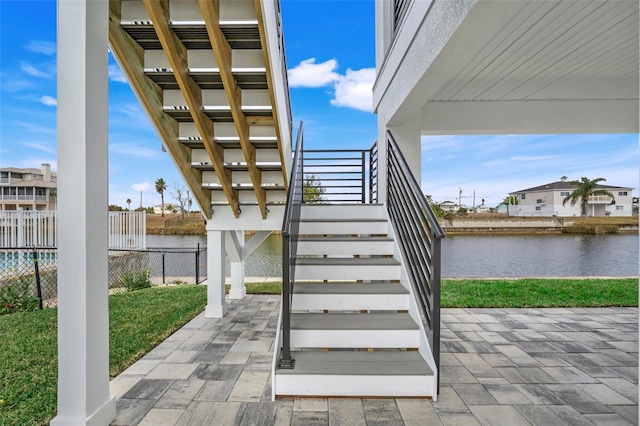 stairway featuring a water view