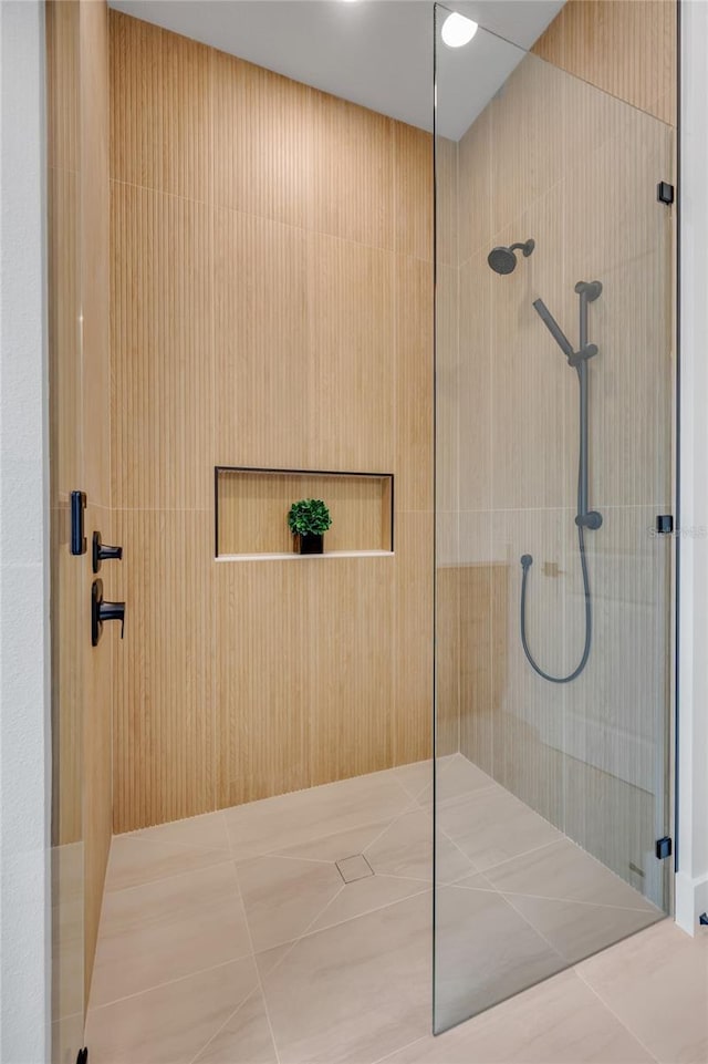 bathroom with a tile shower