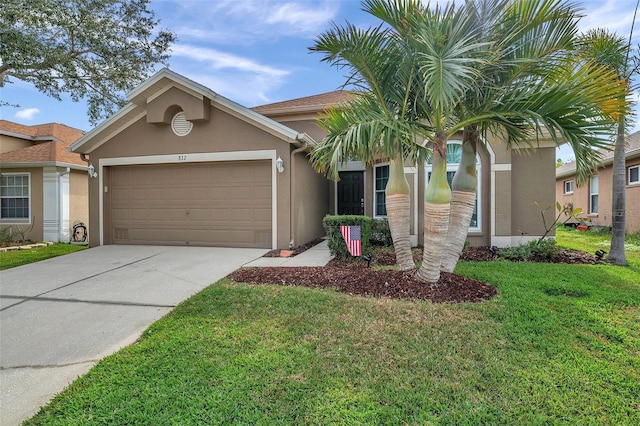 view of front of house featuring a garage and a front yard