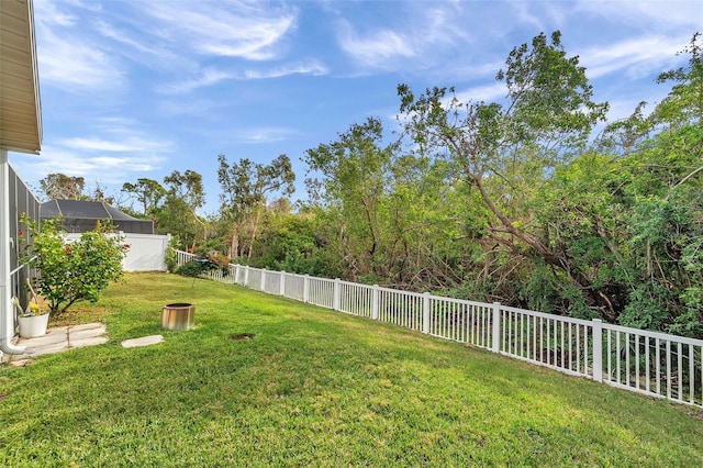 view of yard featuring a lanai