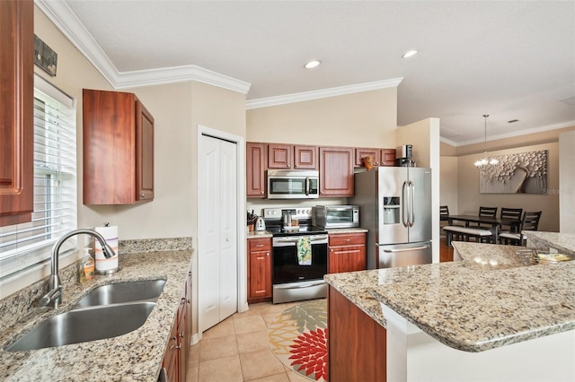 kitchen featuring light stone countertops, appliances with stainless steel finishes, hanging light fixtures, light tile patterned floors, and sink