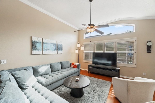 living room with ceiling fan, dark wood-type flooring, crown molding, and vaulted ceiling