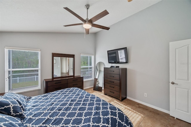 bedroom featuring ceiling fan and lofted ceiling