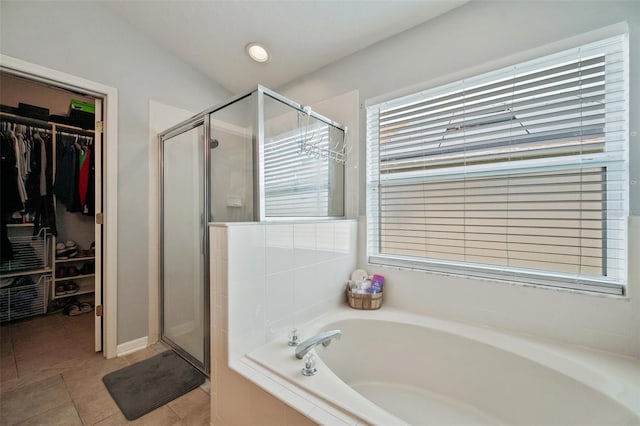 bathroom featuring separate shower and tub and tile patterned floors