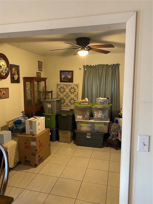 storage area featuring ceiling fan