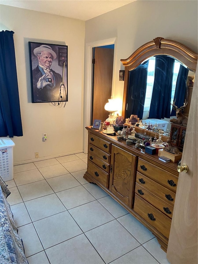 bathroom with tile patterned flooring and vanity