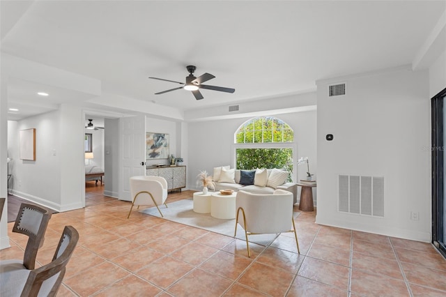 living room with ceiling fan and light tile patterned floors