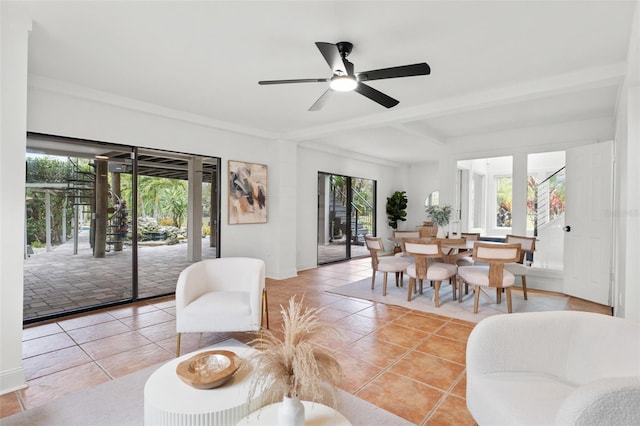 tiled living room with ceiling fan and plenty of natural light