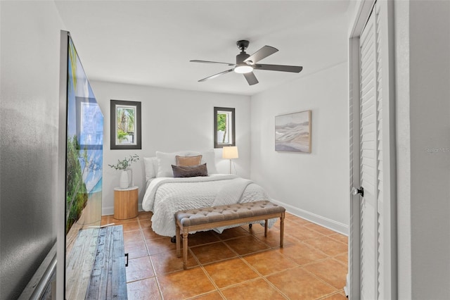 bedroom featuring ceiling fan and light tile patterned flooring