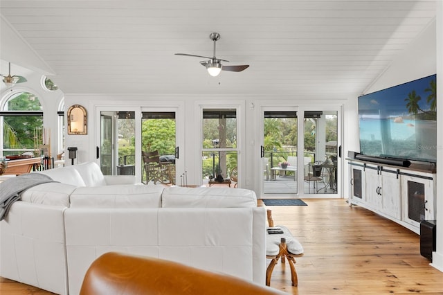 living room with lofted ceiling, ceiling fan, light wood-type flooring, and wooden ceiling