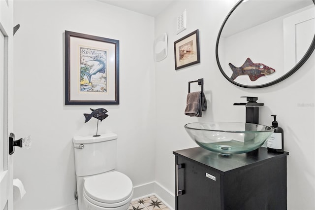 bathroom with toilet and vanity