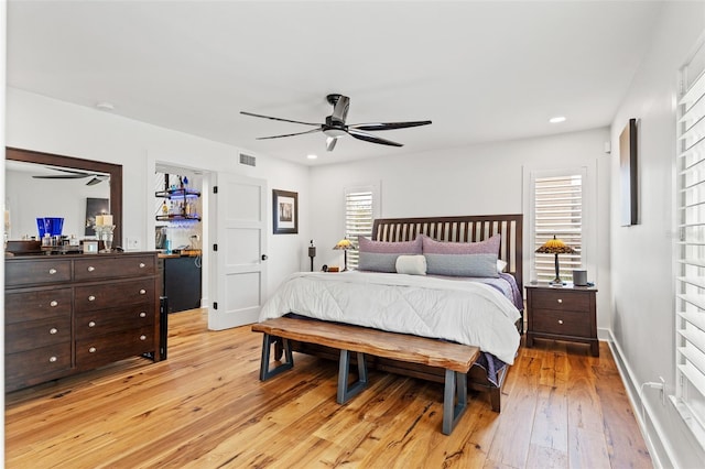 bedroom featuring ceiling fan and light hardwood / wood-style floors