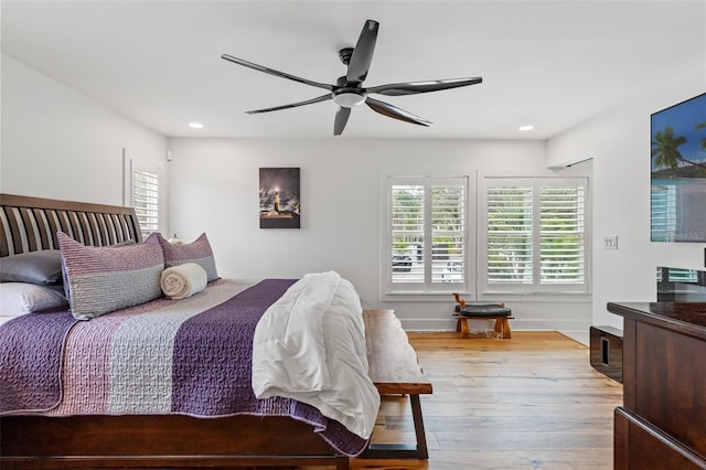 bedroom featuring ceiling fan and light hardwood / wood-style flooring