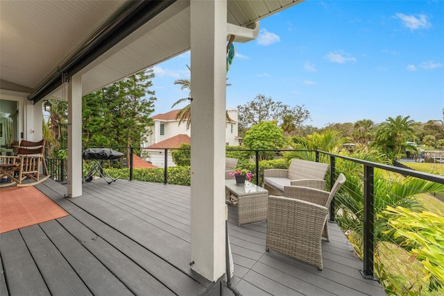 wooden terrace featuring outdoor lounge area