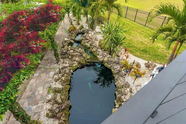 exterior space featuring a garden pond