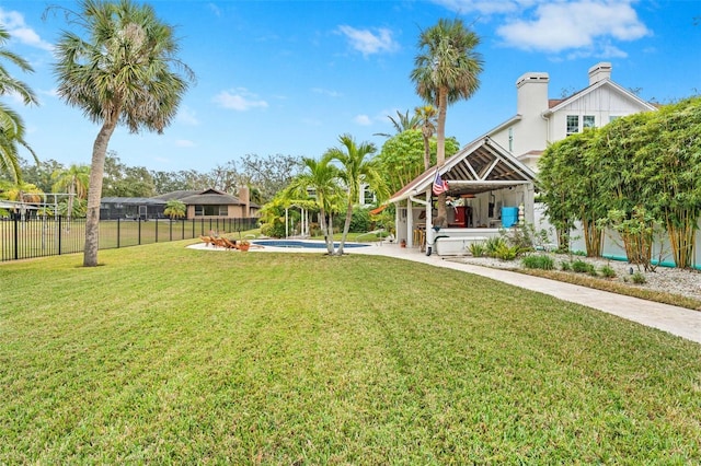 view of yard with a fenced in pool