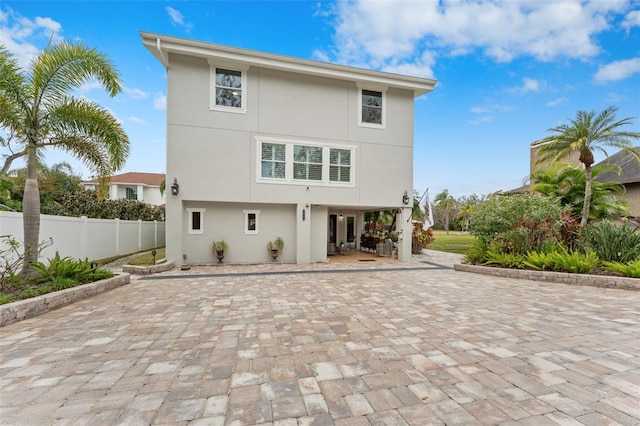 rear view of house featuring a patio area