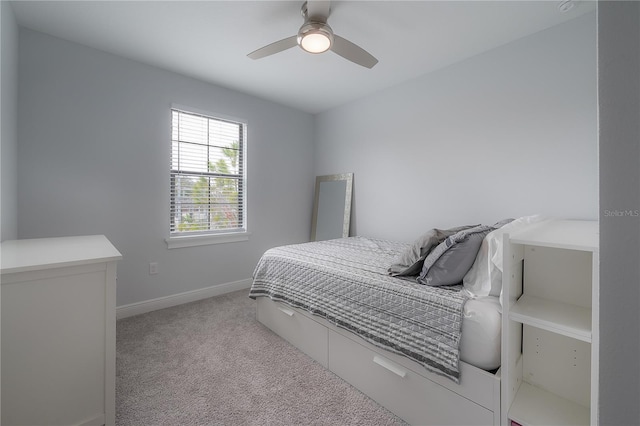 bedroom featuring ceiling fan and light colored carpet