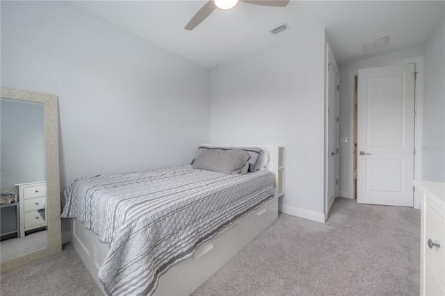 bedroom with ceiling fan and light colored carpet