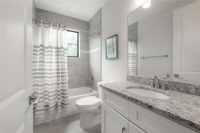 full bathroom featuring toilet, tile patterned flooring, shower / bath combo with shower curtain, and vanity