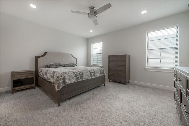 bedroom featuring ceiling fan and light carpet