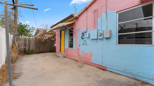 view of side of home featuring a patio area