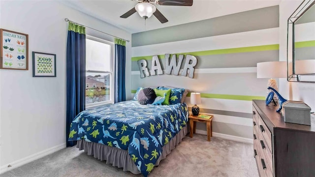 bedroom with ceiling fan and light carpet