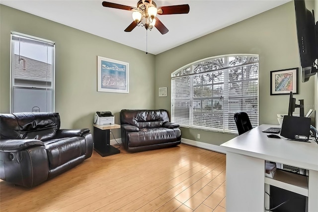 office space with light hardwood / wood-style floors, ceiling fan, and plenty of natural light