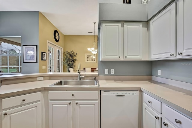 kitchen featuring hanging light fixtures, french doors, white dishwasher, white cabinets, and sink