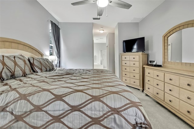 carpeted bedroom featuring connected bathroom and ceiling fan