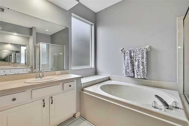 bathroom with vanity, tile patterned flooring, and independent shower and bath