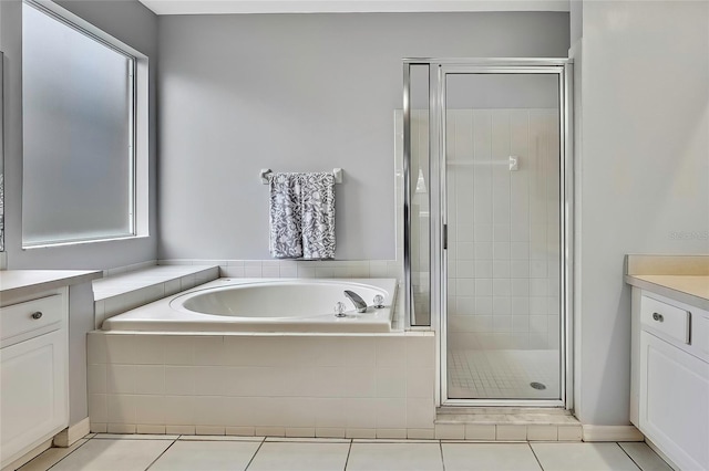 bathroom with vanity, tile patterned floors, and independent shower and bath