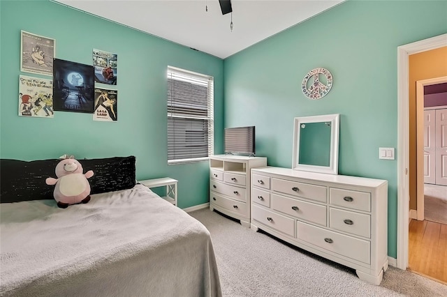 carpeted bedroom with ceiling fan