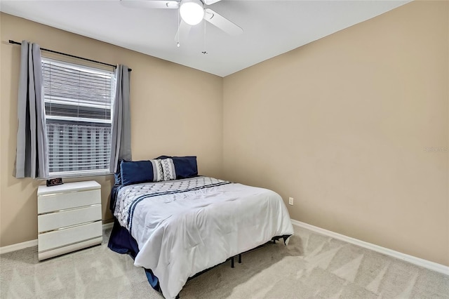 bedroom with light colored carpet and ceiling fan