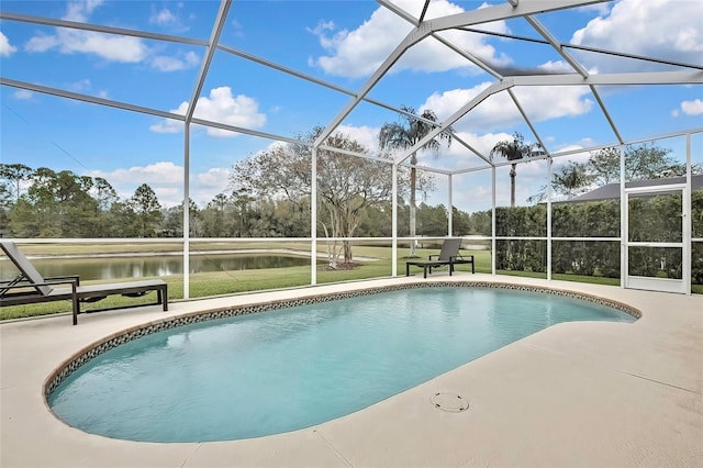 view of swimming pool with a patio area, glass enclosure, a lawn, and a water view