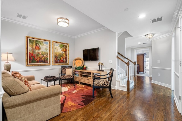 living room with dark hardwood / wood-style flooring and crown molding