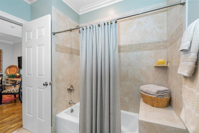 bathroom featuring ornamental molding and shower / bath combo with shower curtain