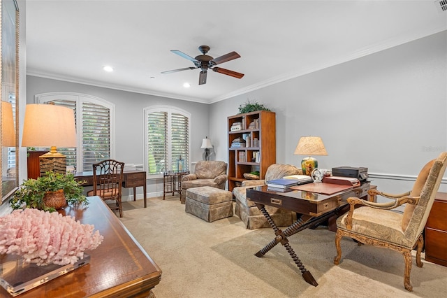 office space featuring ornamental molding, ceiling fan, and light colored carpet